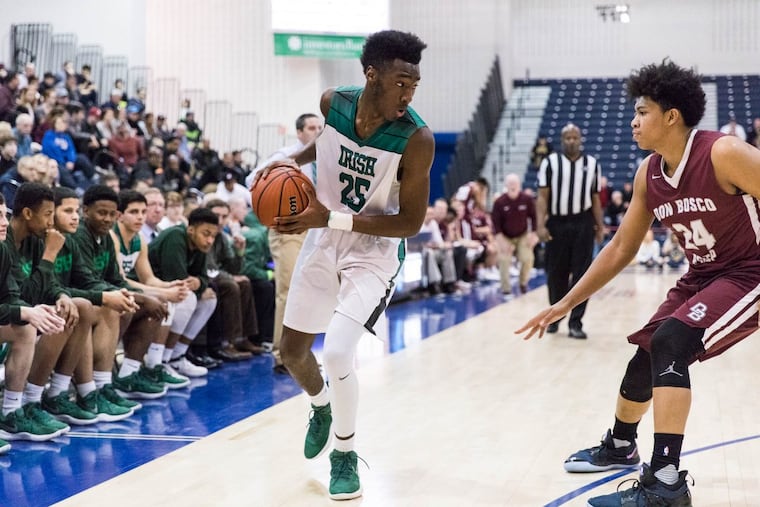 Camden Catholic’s Baba Ajike guards the ball from Don Bosco Prep’s Ronald Harper.