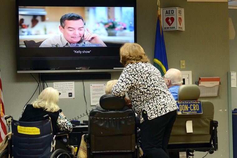 Residents gather around a television in the recreation room at the Neshaminy Manor in Warrington, Pennsylvania. (WILLIAM THOMAS CAIN / For The Philadelphia Inquirer)