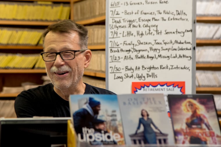 John Tardino talks with a customer at The Video Store July 11, 2019. A Levittown institution for nearly four decades, the store outlived Blockbuster and other national chains, but will finally be closing in September.