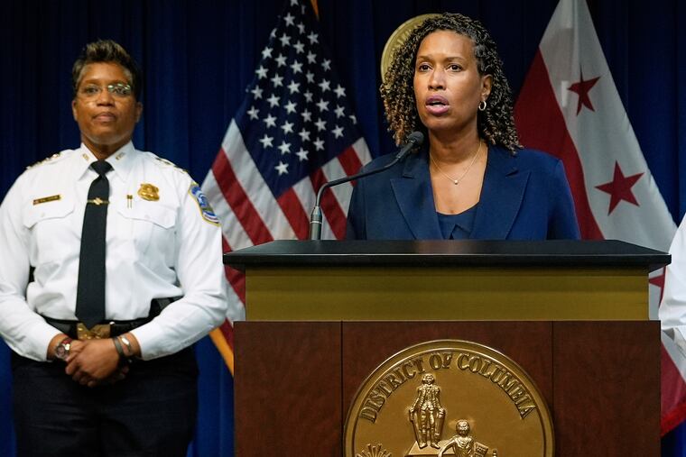 Washington, D.C., Mayor Muriel Bowser and Metropolitan Police Department Chief Pamela A. Smith attend a news conference on Monday about President Donald Trump's plan to place D.C. police under federal control and deploy National Guard troops in the city.