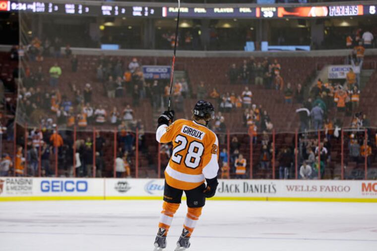 Claude Giroux in action during an NHL hockey game against the Columbus Blue Jackets, Thursday, Dec. 19, 2013, in Philadelphia. (Matt Slocum/AP)
