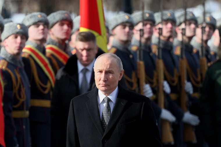 FILE - Russian President Vladimir Putin attends a wreath-laying ceremony at the Tomb of the Unknown Soldier near the Kremlin Wall during the national celebration of "Defender of the Fatherland Day" in Moscow, Russia, Feb. 23, 2026.