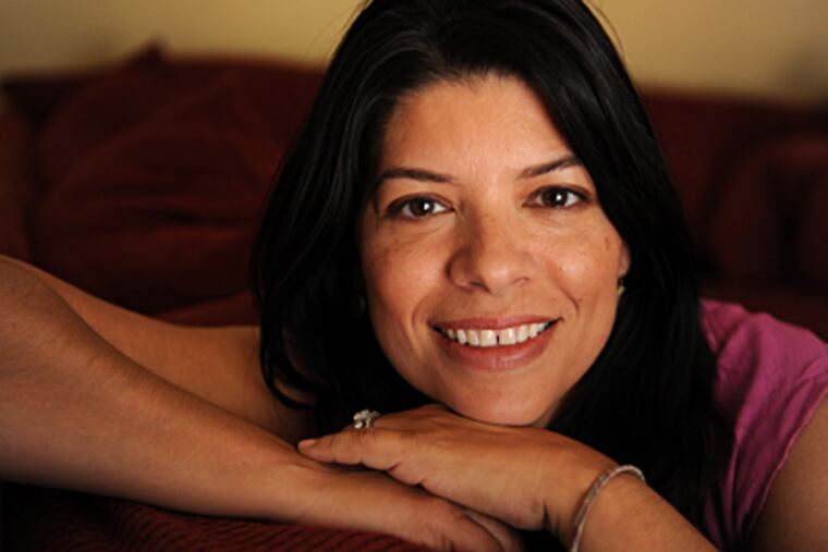 The gap in the front teeth is in and Geneva Aguirre, 48, shows off her smile in Concord, Calif. She has had the look all her life. (Susan Tripp Pollard/Contra Costa Times/MCT)