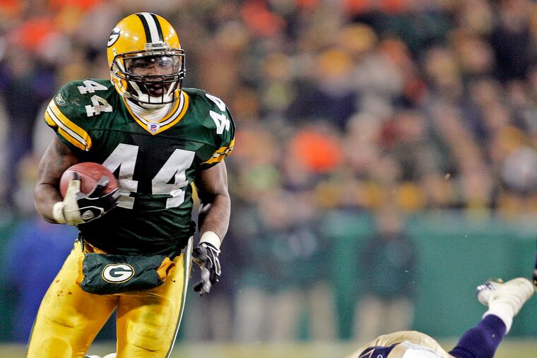 File-Green Bay Packers' Najeh Davenport breaks away from St. Louis Rams' Rich Coady (25) for a 40-yard touchdown run in the fourth quarter Monday, Nov. 29, 2004, in Green Bay, Wis. Dementia tests in the NFL concussion litigation allow doctors to use different baseline standards for Black and white retired players, making it more difficult for Blacks to show injury and qualify for awards, lawyers for two ex-players argued in court filings Tuesday, Aug. 25, 2020. Lawyers for ex-players Kevin Henry and Davenport said their clients were denied awards “based on a discriminatory testing regime" that weighs sociological factors including race. Both men would have qualified for awards had race not been considered, they said. (AP Photo/Morry Gash, File)