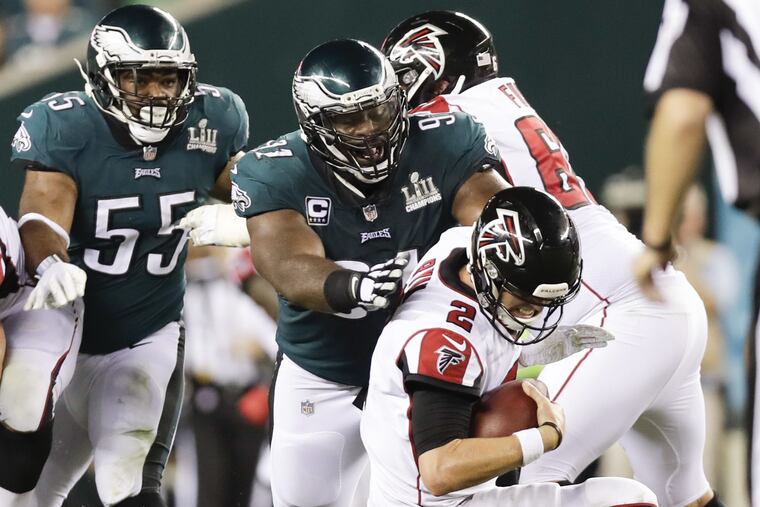 Defensive end Fletcher Cox goes after Falcons quarterback Matt Ryan during the Eagle's season opener.