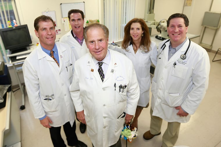 All four of Dr. Joseph Hassman's children are doctors: from left are David, Howard, Elissa and Michael. All four have joined their dad in his practice in Berlin, N.J.