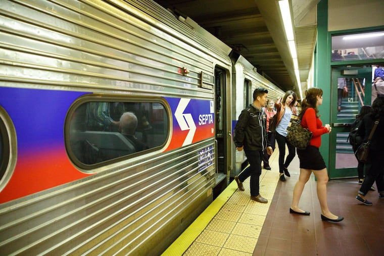 Commuters disembark at Suburban Station, in Philadelphia. JESSICA GRIFFIN / Staff Photographer