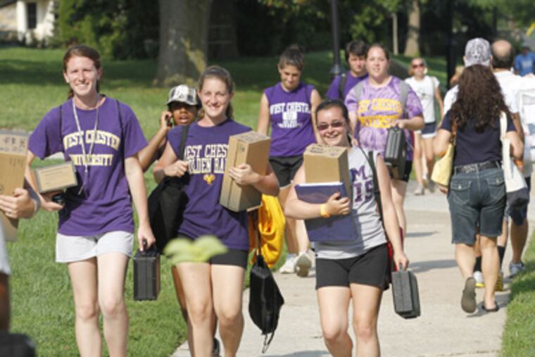 West Chester University was bustling with activity as students made their way across campus during move-in day. (Charles Fox / Staff Photographer)