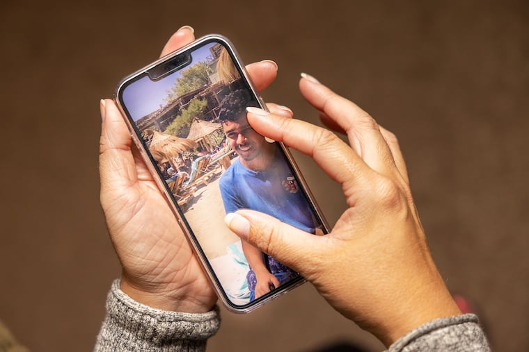 Meredith Elizalde holds a photograph of her son, Nicolas, who was fatally shot after his football scrimmage on Tuesday outside of Roxborough High School. Nick was 14, set to turn 15 on Oct. 8.