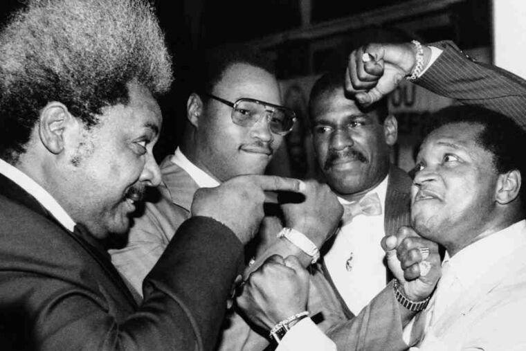 Boxing promoter Butch Lewis (right) poses with Don King (left), Larry Holmes and Michael Spinks in 1985 in New York City to promote Holmes and Spinks' fight later that year in Las Vegas.