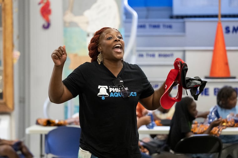 Charisma Presley of Philly Aquatics speaks to students about safety during dry-land skills training at the Finley Rec Center in North Philadelphia on July 30, 2025.