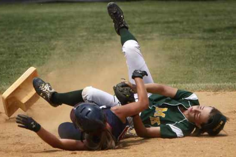 Second base goes flying as Eastern's Madison Tiernan (left) collides with Morris Knolls' Tori Clarke. Tiernan was out. Morris Knolls went on to win the Group 4 title.