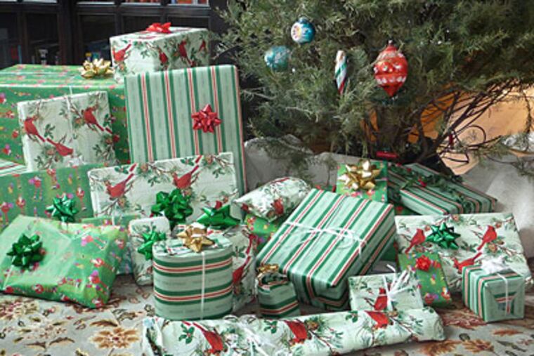 Wrapped presents under a tree are an iconic image of Christmas. (Russ Burden/Digital Photo Academy/MCT)