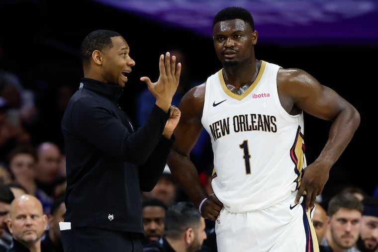 New Orleans Pelicans head coach Willie Green talks to forward Zion Williamson against the Sixers on Friday, March 8, 2024 in Philadelphia.