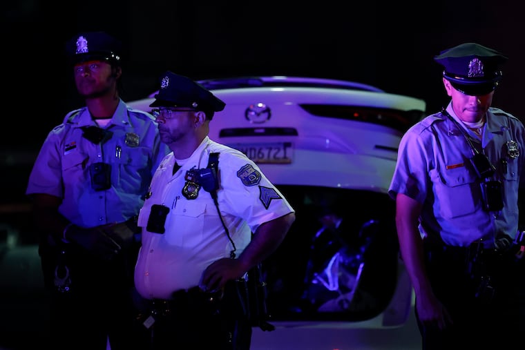 Police examine the scene of a fatal shooting at East Courtland and North Front Streets in September. Philadelphia recorded the fewest homicides in nearly 60 years in 2025.