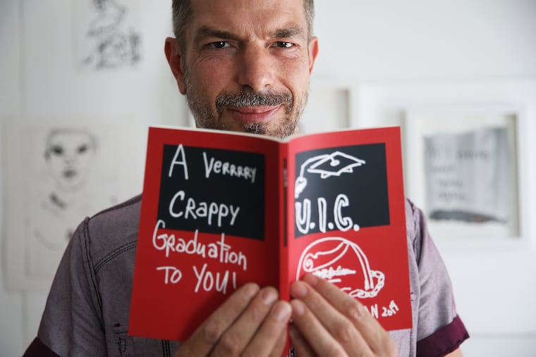 Artist Joe Ovelman stands for a portrait with his book "You I See" in his home studio in North Philadelphia. "You I See" is about the student loan crisis.