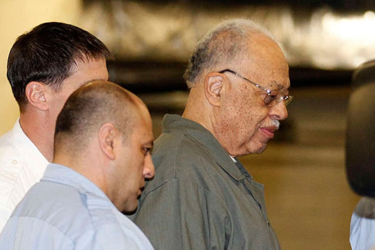 Dr. Kermit Gosnell gets escorted to a van leaving the Criminal Justice Center after getting convicted on three counts of first degree murder on Monday, May 13, 2013. (Yong Kim / Staff Photographer)