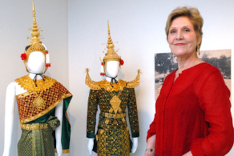 Rita Moonsammy, guest curator of "Culture in Context," with classical Cambodian dance costumes. The museum will reopen tomorrow after a four-year, $15 million renovation.