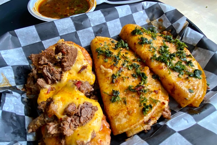 The Belcher birria box at Tina's Tacos includes chalupa, taco, and queso taco.