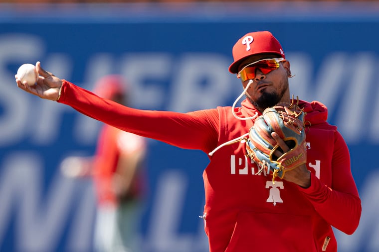 New Phillies second baseman Luis Arraez warms up before his debut on Tuesday against the Nationals.