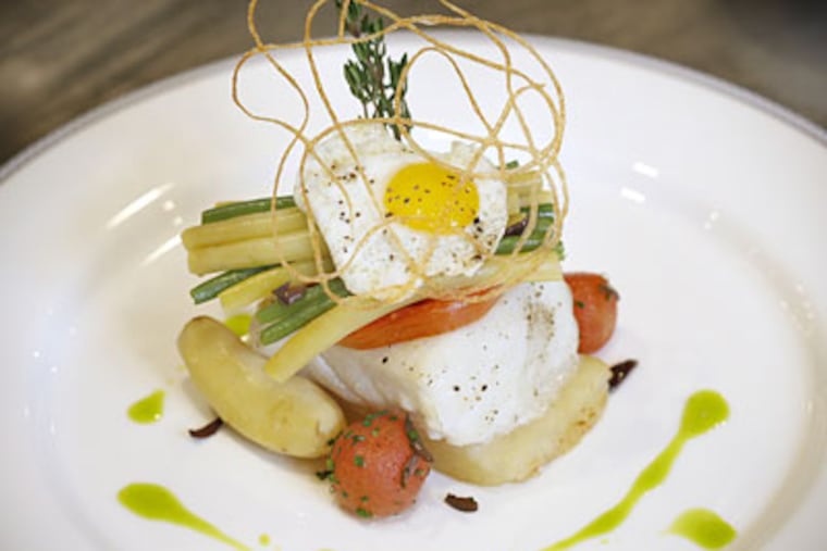 Halibut Portugese Style with heirloom tomatoes, bean duet and a quail egg 1862 in the Union League. ( David Maialetti / Staff Photographer )