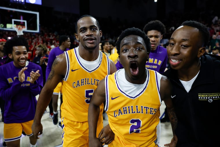 Roman Catholic’s Kabrien Goss (2) celebrates his game winning overtime basket against Archbishop Ryan at the Palestra.