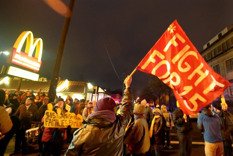 Protestors for Nationwide Fight for $15 Day of Disruption gather near McDonald’s at 24th St. E. and Franklin Avenue, where for about a half hour protestors sat in a circle and blocked the intersection until they were arrested by Minneapolis police Tuesday, Nov. 29, 2016.