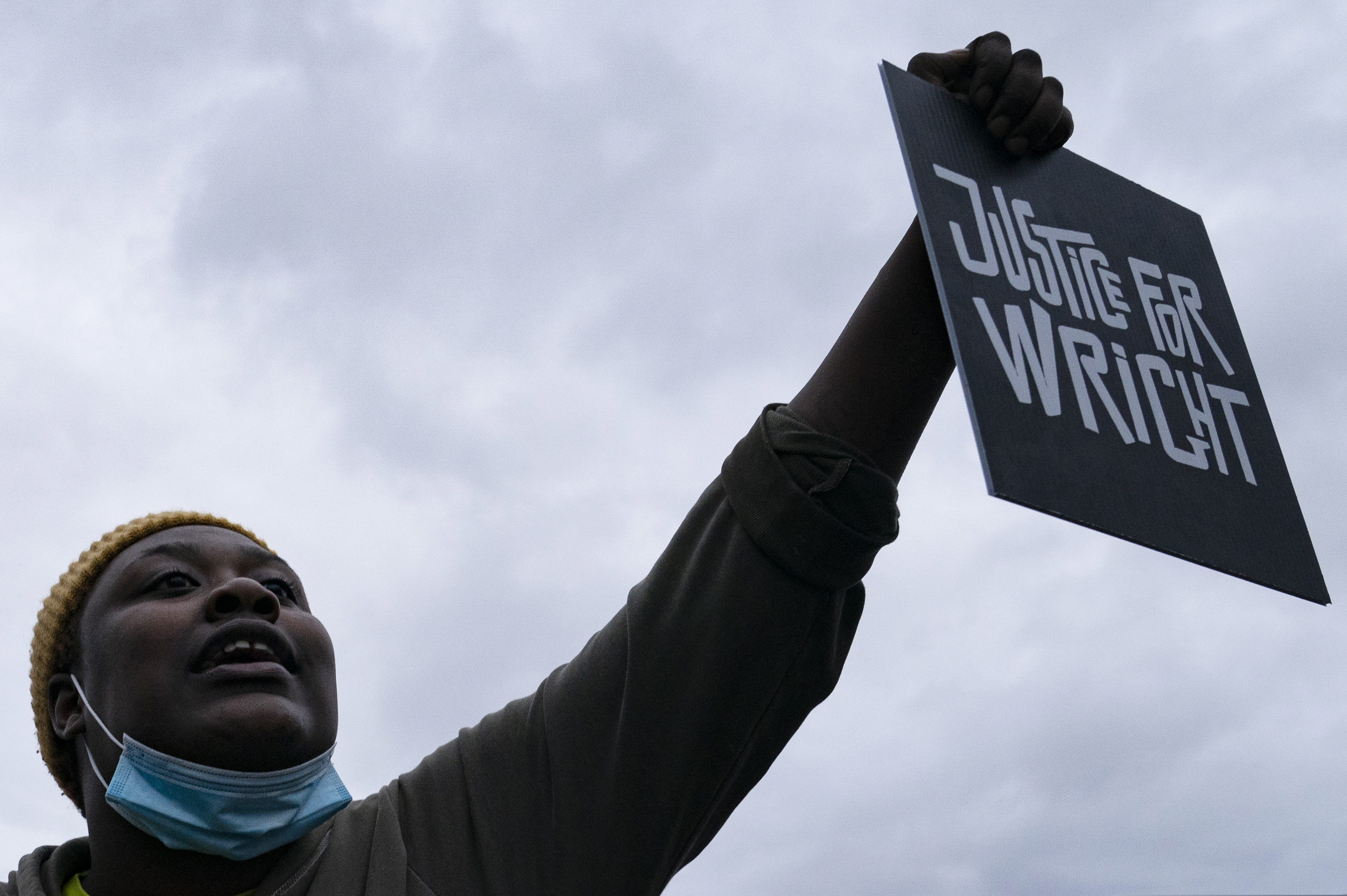 A demonstrator holds a sign during a protest over the fatal shooting of Daunte Wright during a traffic stop, outside the Brooklyn Center (Minn.) Police Department in April. A new Philadelphia law could prevent shootings like this. It should be expanded state-wide.