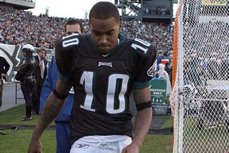 Eagles' DeSean Jackson walks off the field after sustaining a concussion against the Redskins. (Yong Kim / Staff Photographer)