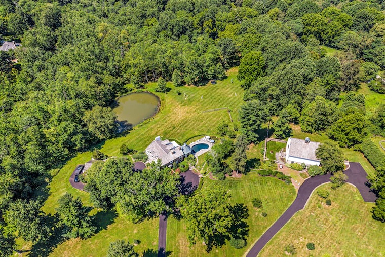 This aerial shot shows 418 and 420 Dutton Mill Rd. in Willistown Township, properties that include the main house and a barn and are listed for sale together with a third property for $8.95 million.