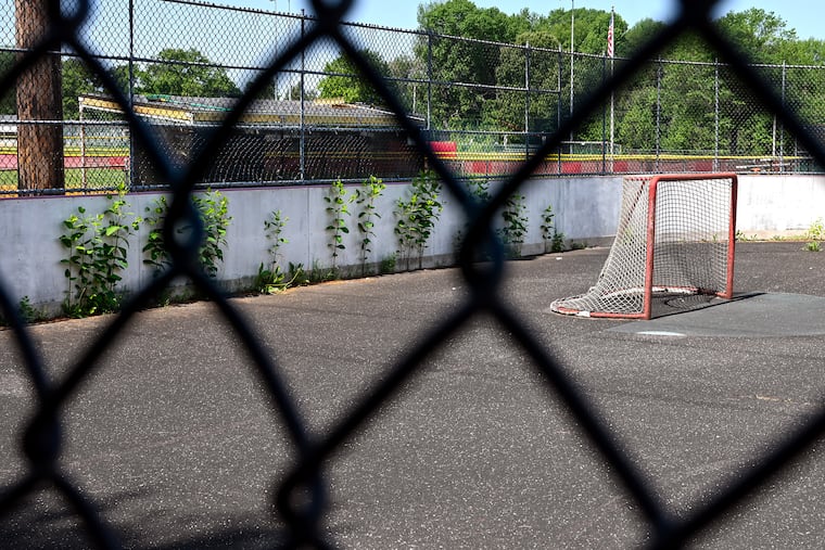 Weeds grow along the boards of the closed street hockey court at the Gibbstown Sports Complex on Monday. It is one of the local rinks Flyers Charities will be renovating through Rink Revive, “a community initiative aimed at transforming local hockey rinks and expanding access to the game for players of all ages.”