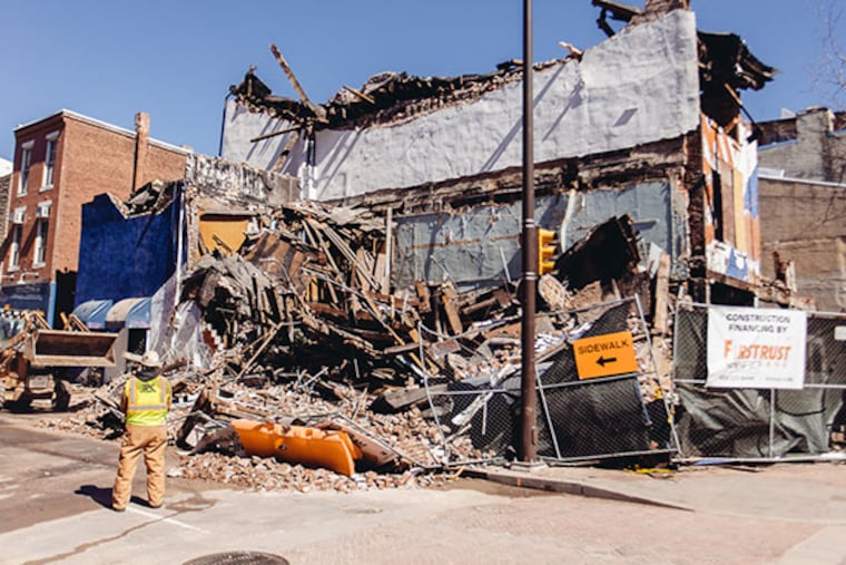 The Shirt Corner collapsed during demolition work in Philadelphia on March 13, 2014. (Dan King / For Philly.com)