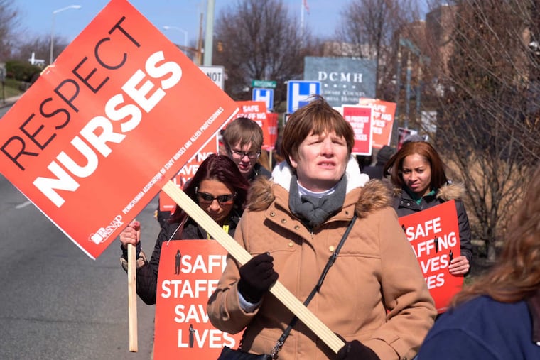 Striking nurses picket outside Delaware County Memorial Hospital on Monday morning.