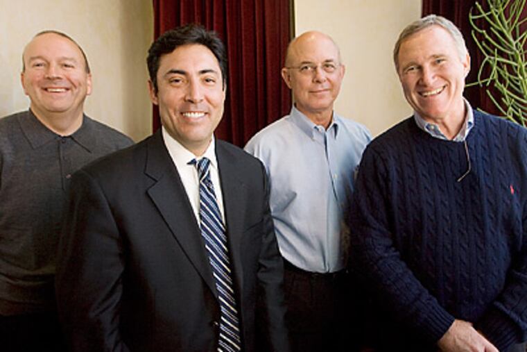Chuck LaMar (far right) became the Phillies' assistant GM for player development & scouting in 2008. (Jessica Griffin/Staff file photo)