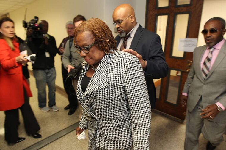 State Sen. LeAnna Washington (center) leaves court in Norristown on Thursday after being sentenced to three months of house arrest and 57 months of probation. She was also ordered to pay $200,000 in restitution.
