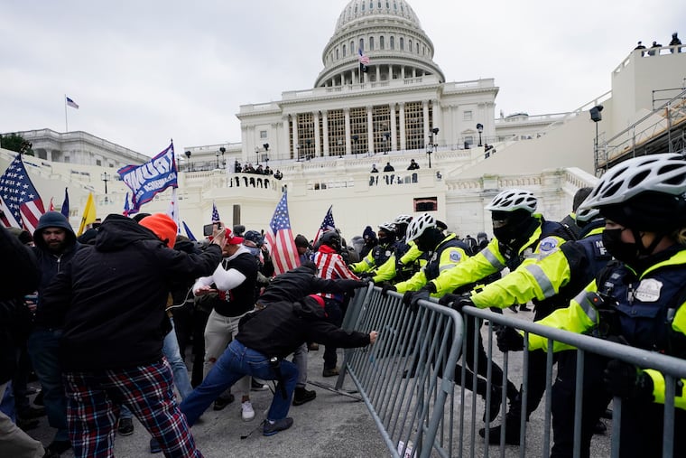 FILE - Violent insurrections loyal to President Donald Trump break through a police barrier at the Capitol in Washington. Over months, the House Select Committee investigating the Jan. 6 U.S. Capitol insurrection has issued more than 100 subpoenas, done more than 1,000 interviews and probed more than 100,000 documents.