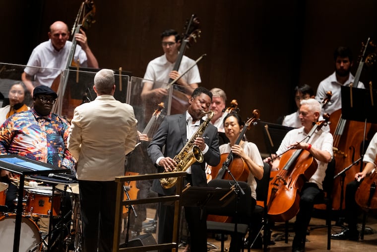 Ravi Coltrane performs with The Philadelphia Orchestra, conducted by Edwin Outwater, during a concert celebrating the 100th anniversary of jazz legend John Coltrane's birth at the TD Pavilion at the Mann in Philadelphia in July. The Orchestra has long been one of the nation's most renowned, but that hasn't prevented financial challenges over the years.
