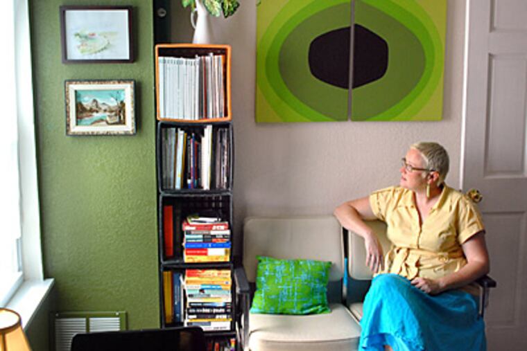 Philadelphia Art Hotel codirector Krista Peel in the communal kitchenette for the upper floors. Participating artists come from around the world. (Tom Gralish/Staff)