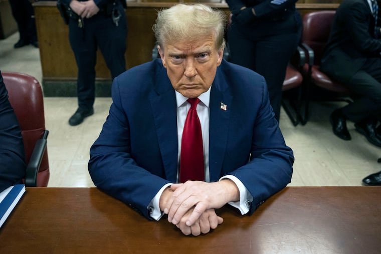 Donald Trump waits for the start of proceedings in Manhattan criminal court on April 23, 2024.