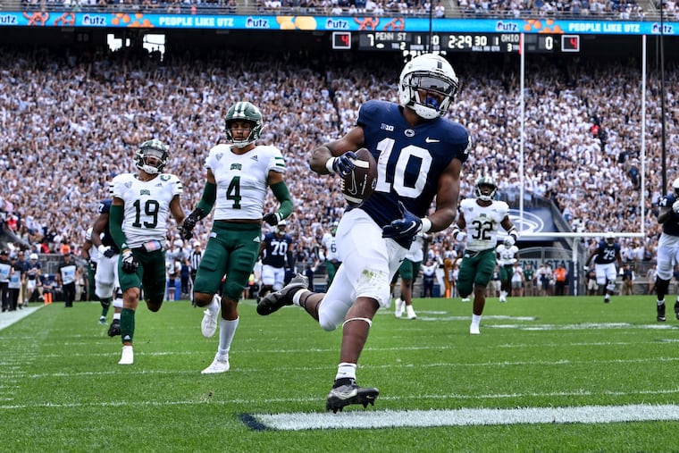 Penn State running back Nicholas Singleton scores on a 70-yard touchdown run in the Nittany Lions' 46-10 win over the Bobcats.