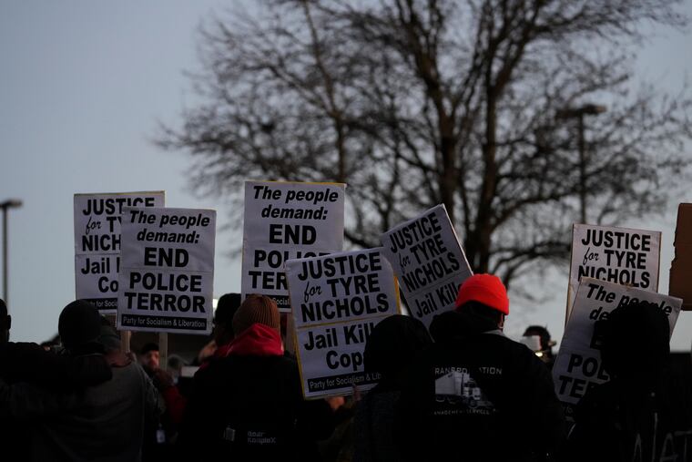 Protesters gather Friday, Jan. 27, 2023, in Memphis, Tenn., as authorities were set to release police video depicting five Memphis officers beating Tyre Nichols, whose death resulted in murder charges and provoked outrage at the country's latest instance of police brutality. (AP Photo/Gerald Herbert)