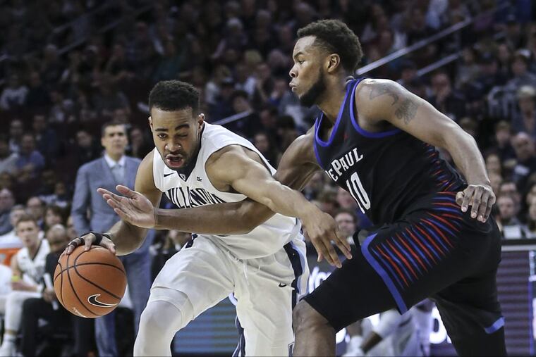 Villanova's Phil Booth drives on DePaul's Tre'Darius McCallum during the first half.