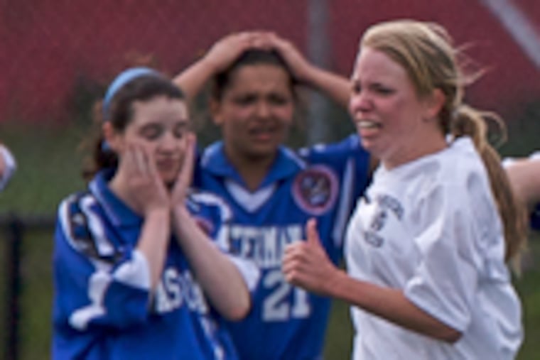 Jaimee Coates runs past a disbelieving Masterman team after scoring the winning goal in overtime in yesterday's Class AA title game. Coates' goal gave Philadelphia Academy Charter a 2-1 victory seven minutes into the second overtime period.