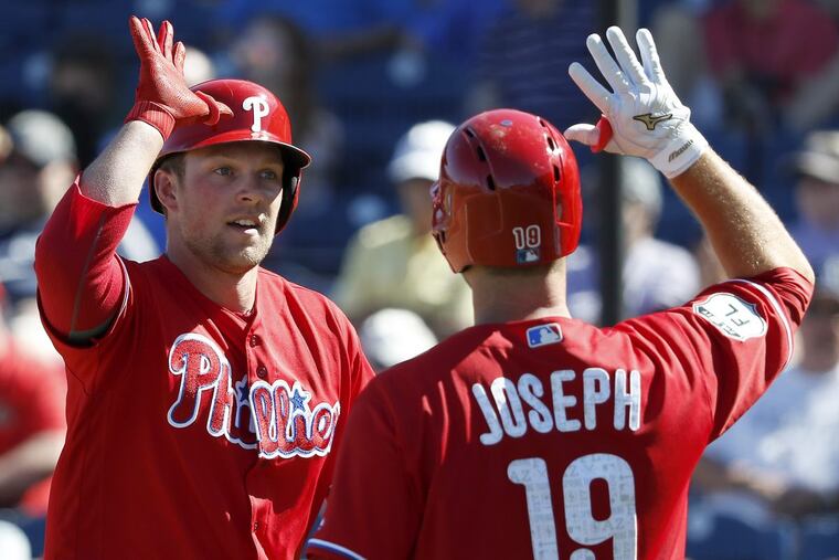 Minor league star Rhys Hoskins (left) may be blocked at the first base job for the Phillies by Tommy Joseph, right. DAVID MAIALETTI / Staff Photographer