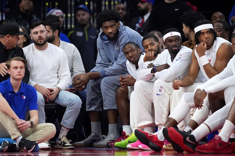 Joel Embiid watches the Sixers play on March 1, the day after the team shut him down for the season.