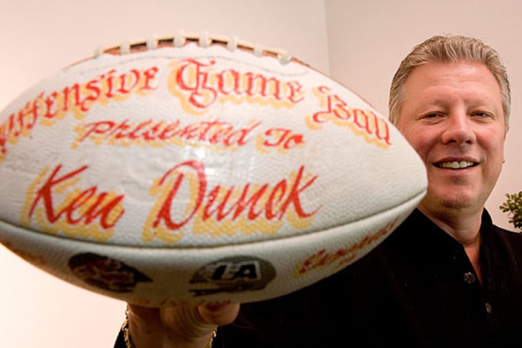 Mt. Laurel resident and former pro football tight end Ken Dunek holds his first touchdown game ball from his days playing for the Philadelphia Stars in the USFL. Dunek is executive producing a film about the USFL.