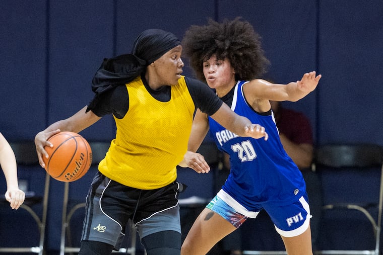 Rachel Thatcher, right, of Paul VI defends against Shayla Smith of Audenried on June 13.