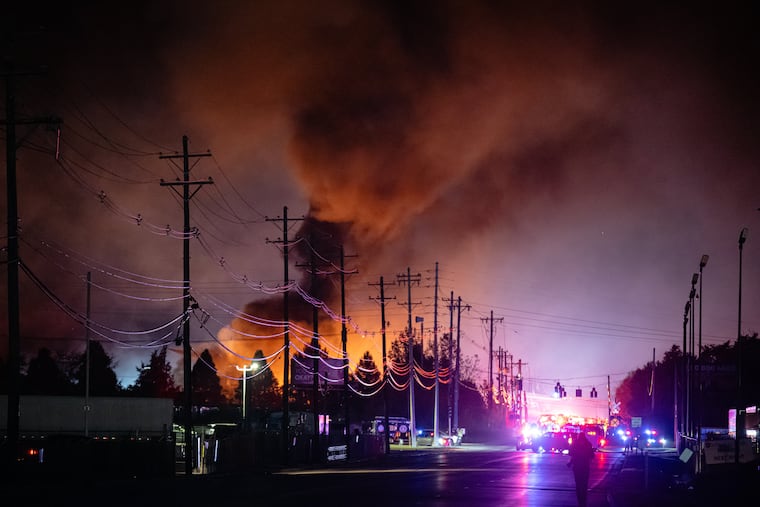 Plumes of smoke rise from the area of a UPS cargo plane crash at Louisville Muhammad Ali International Airport in November.