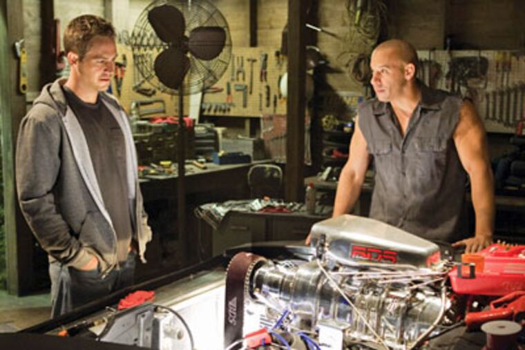 Vin Diesel (right) burns bright, but car pornography is the real star again in "Fast & Furious," the latest installment in the gas-powered franchise. (AP Photo / Universal Pictures, Jaimie Trueblood)