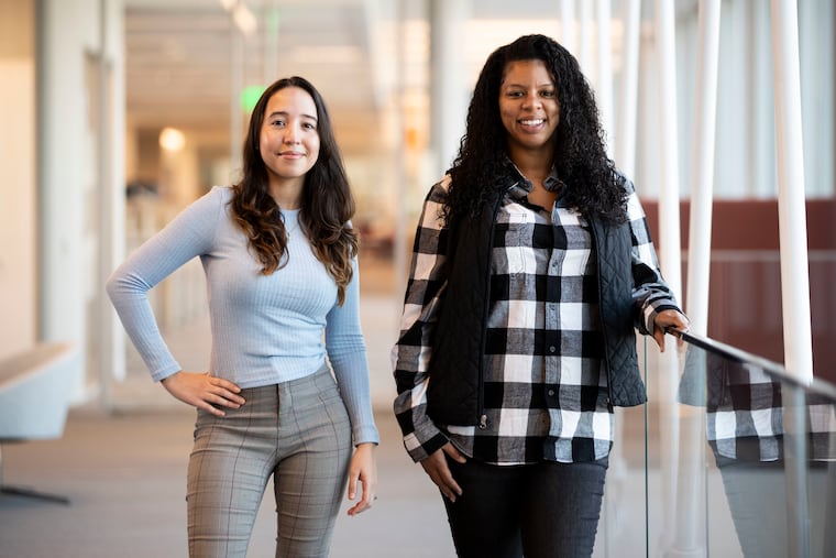 Ashley Pena and Courtney Wakefield at the American Water headquarters on the Camden Waterfront. Both got jobs at the company after completing a training program at Hopeworks, a Camden nonprofit set to bring its program to Philadelphia's Kensington neighborhood.